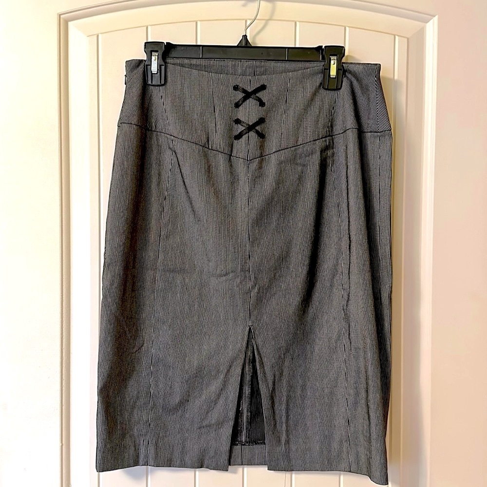 Black pinstripe pencil skirt with lace-up detail on back.